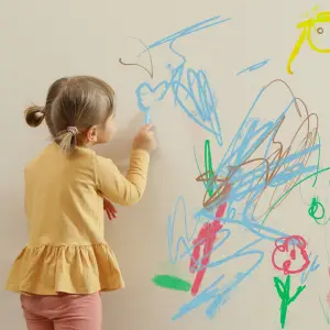 Child drawing on walls